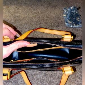 Barely used Louis Vuitton black monogram vernis Huston tote bag.